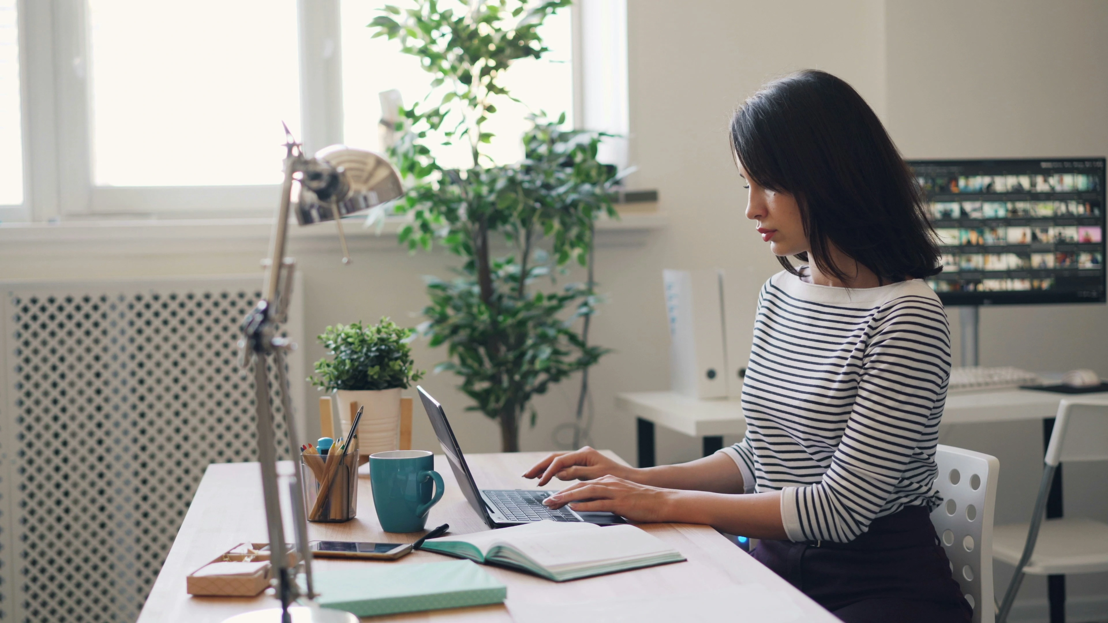 Person working on a laptop designing a website
