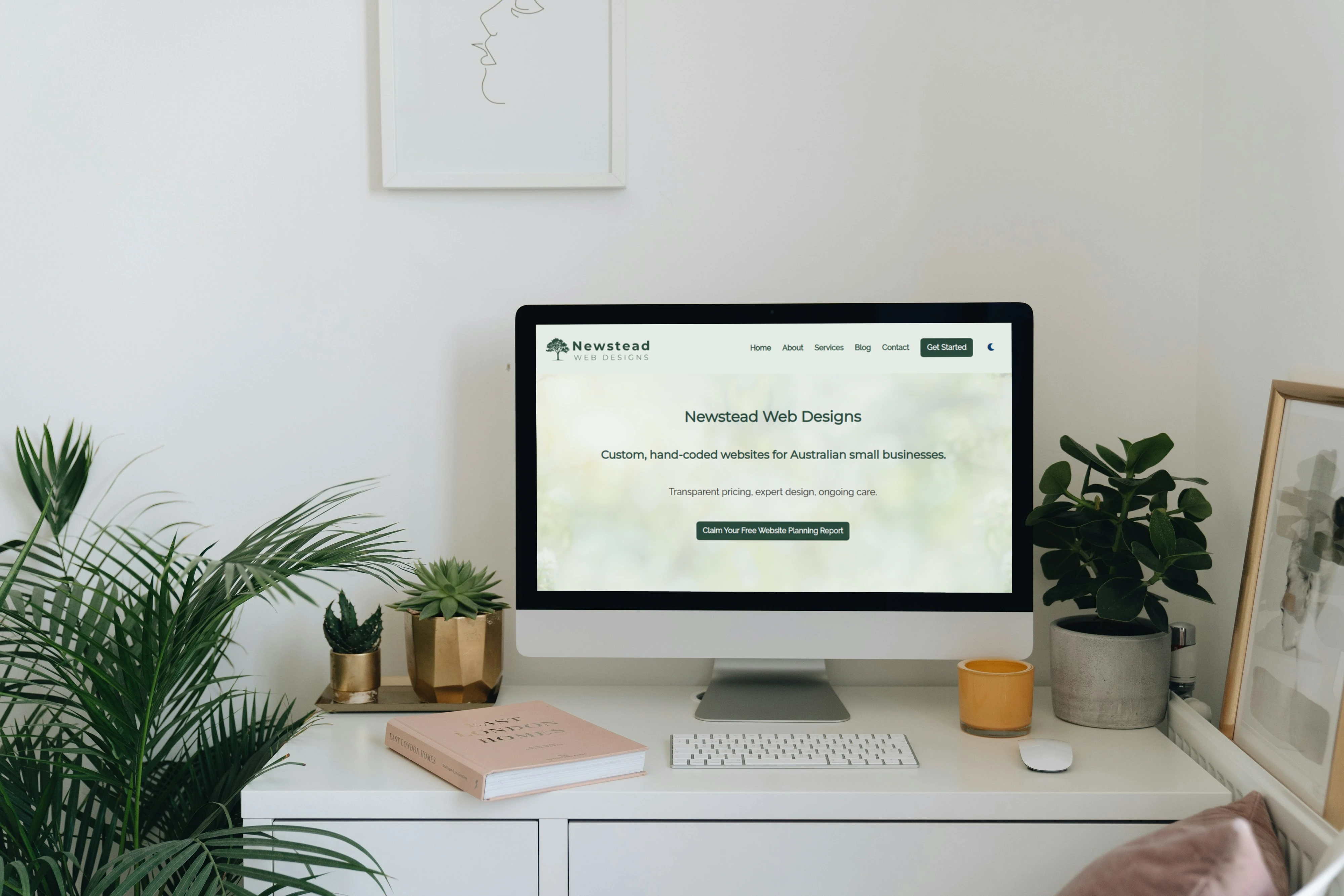 Man holding mobile phone showing Newstead Web Designs website